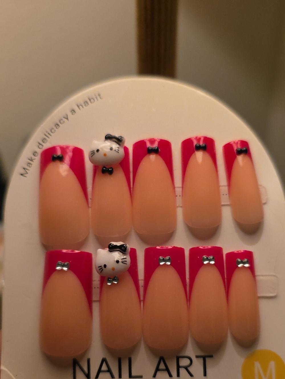 Charming Pink-Tip Press-On Nails with Cream Base and Cat Accents
